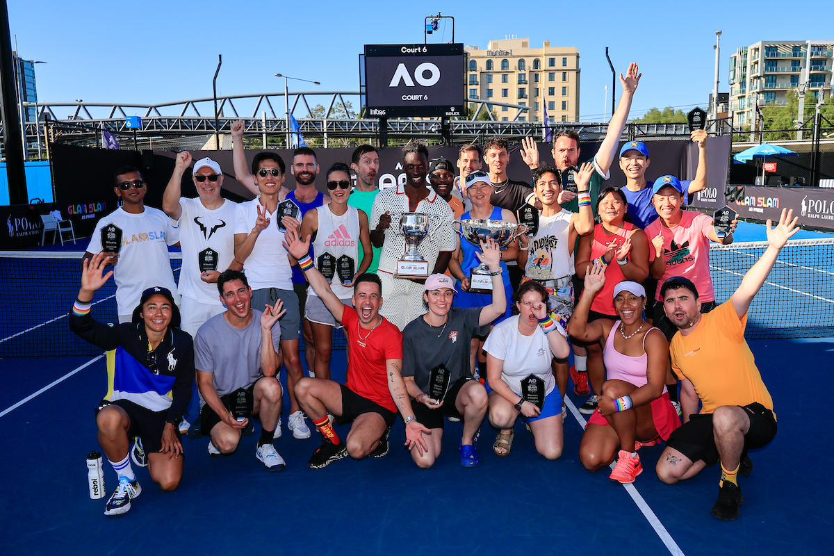 During the Glam Slam on Court 6 at the Australian Open at Melbourne. A group of people on a tennis court wearing Pride wrist bands.