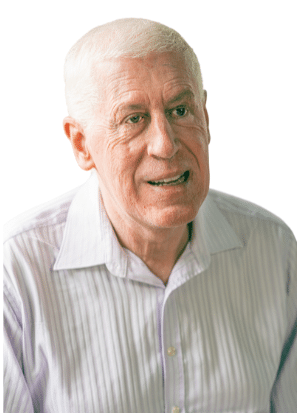 Graeme Innes in a white button-down shirt and white hair.