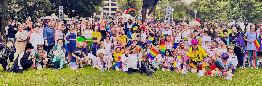 A large group of people wearing brightly coloured clothing.